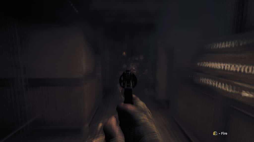 The player hold a gun towards a monster approaching. 