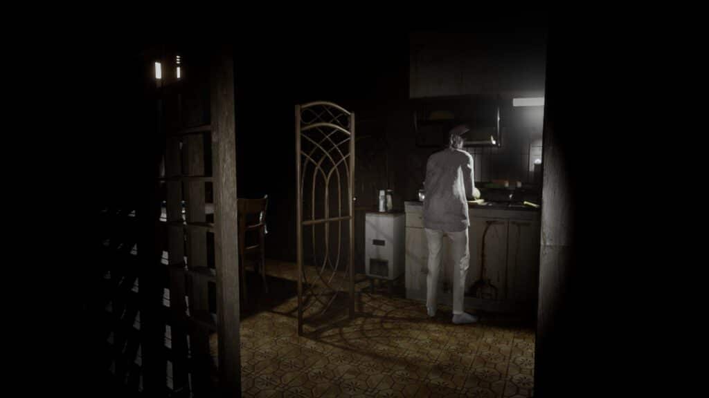 A woman stands over the sink in a dark kitchen