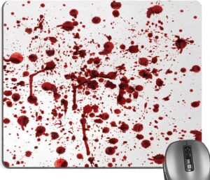 A white mouse pad featuring blood splatter
