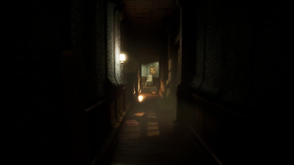 A long, dimly lit hallway with a painting at the end.