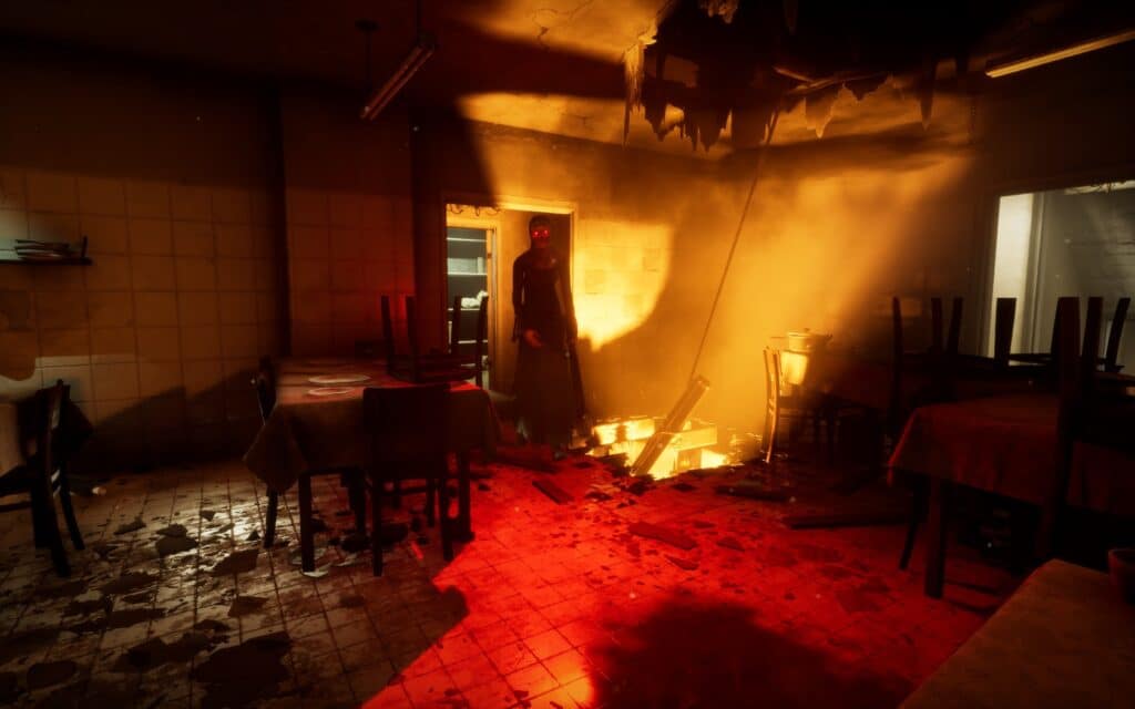 A nun with red eyes stands next to a fire coming through the floor